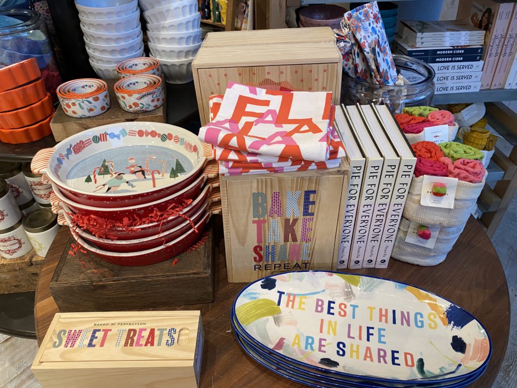 Colorful bowls and plates with positive messages on a table.