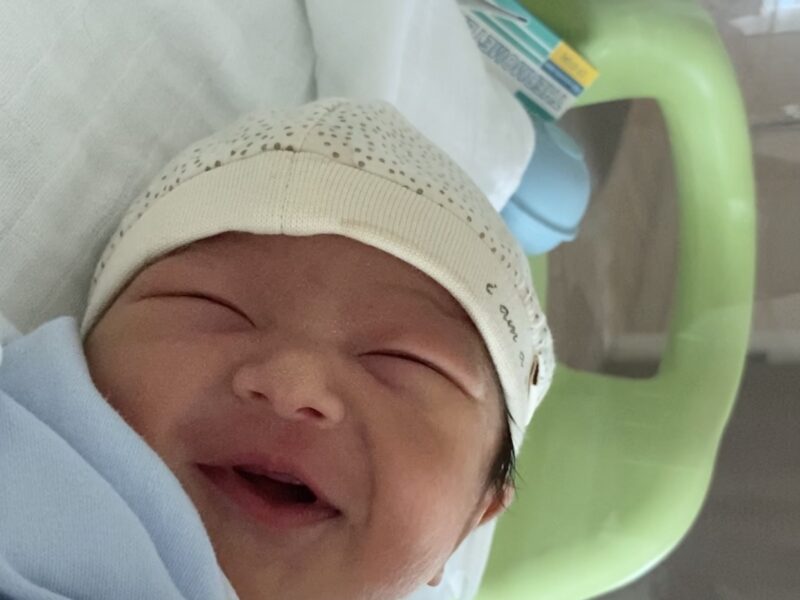 Baby Theo smiles