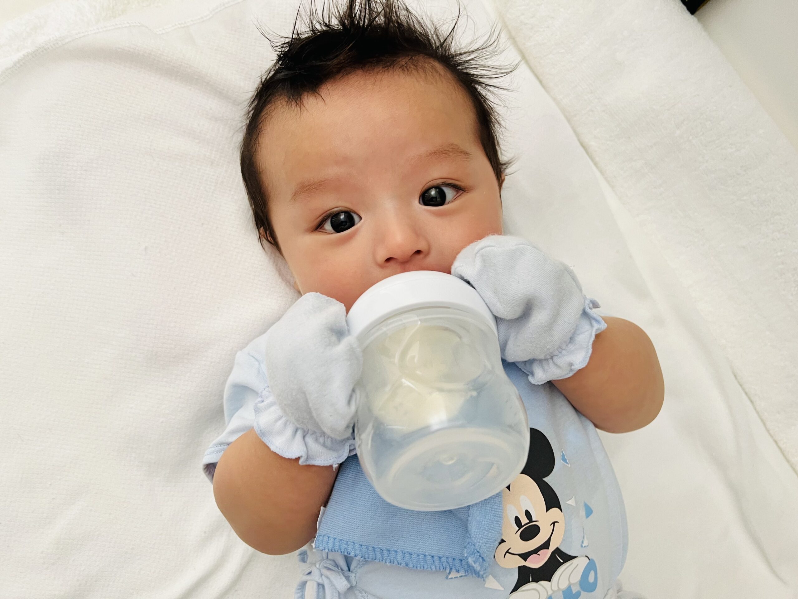 Baby Theo drinks milk