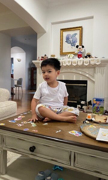 Theo sits on the table