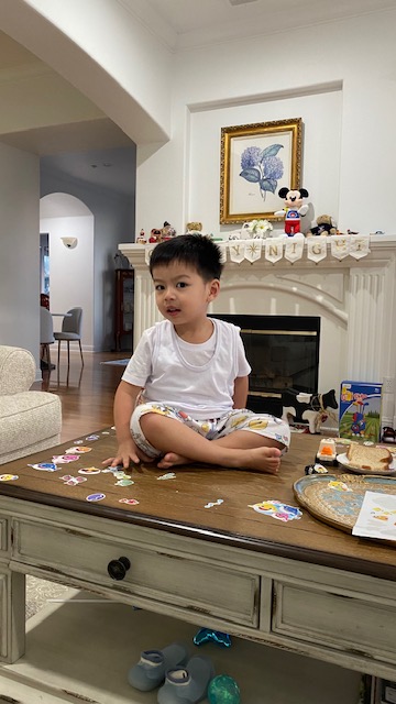 Theo sits on the table